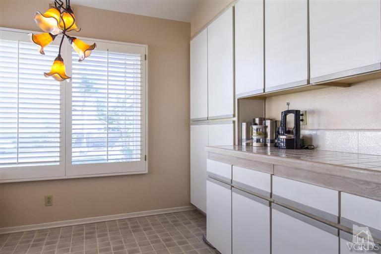 553 Galloping Hill Road Simi Valley, CA 93065 - Photo 8 of 20 a kitchen with a sink and cabinets