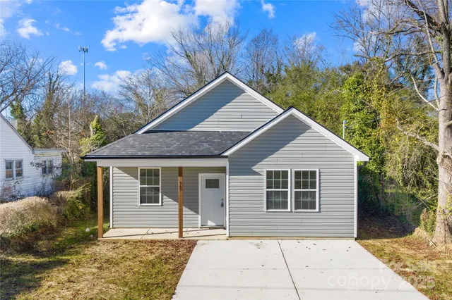 a house with trees in the background