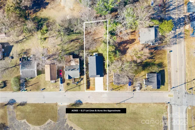a view of a house with a snow in the background