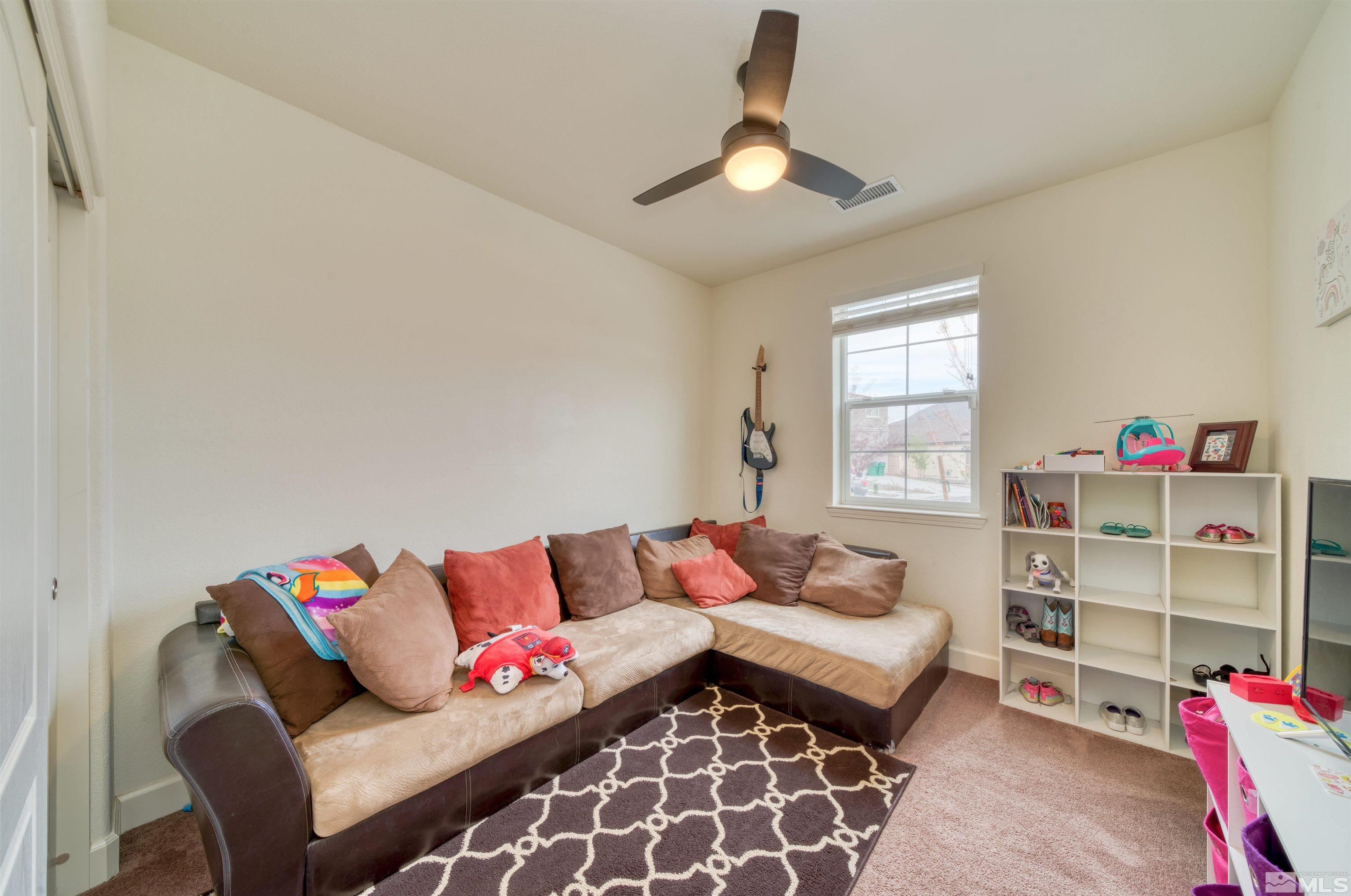 9784 Quartette Drive Reno, NV 89521 - Photo 13 of 18 a living room with furniture and a window
