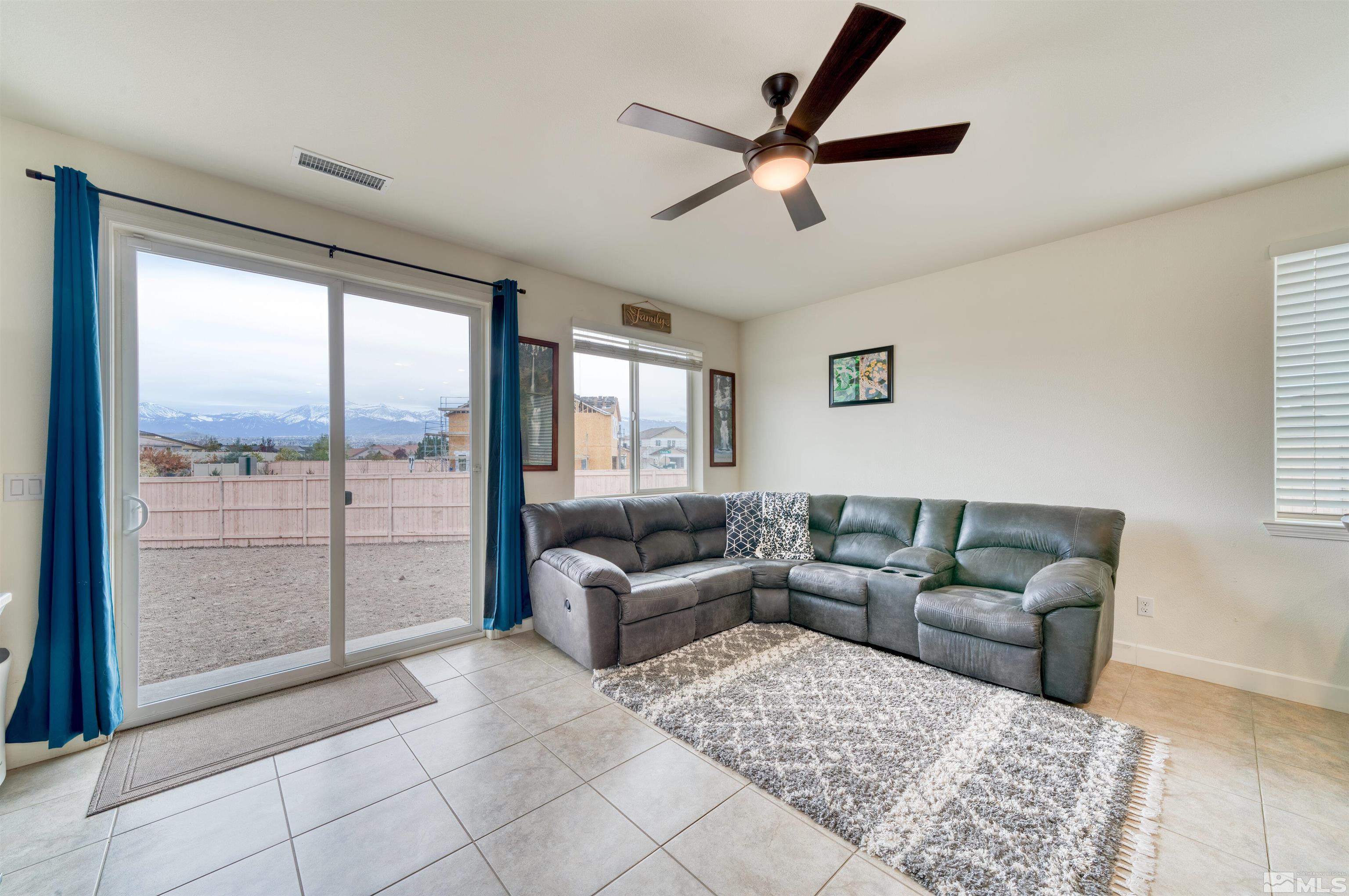 9784 Quartette Drive Reno, NV 89521 - Photo 4 of 18 a living room with furniture and a large window