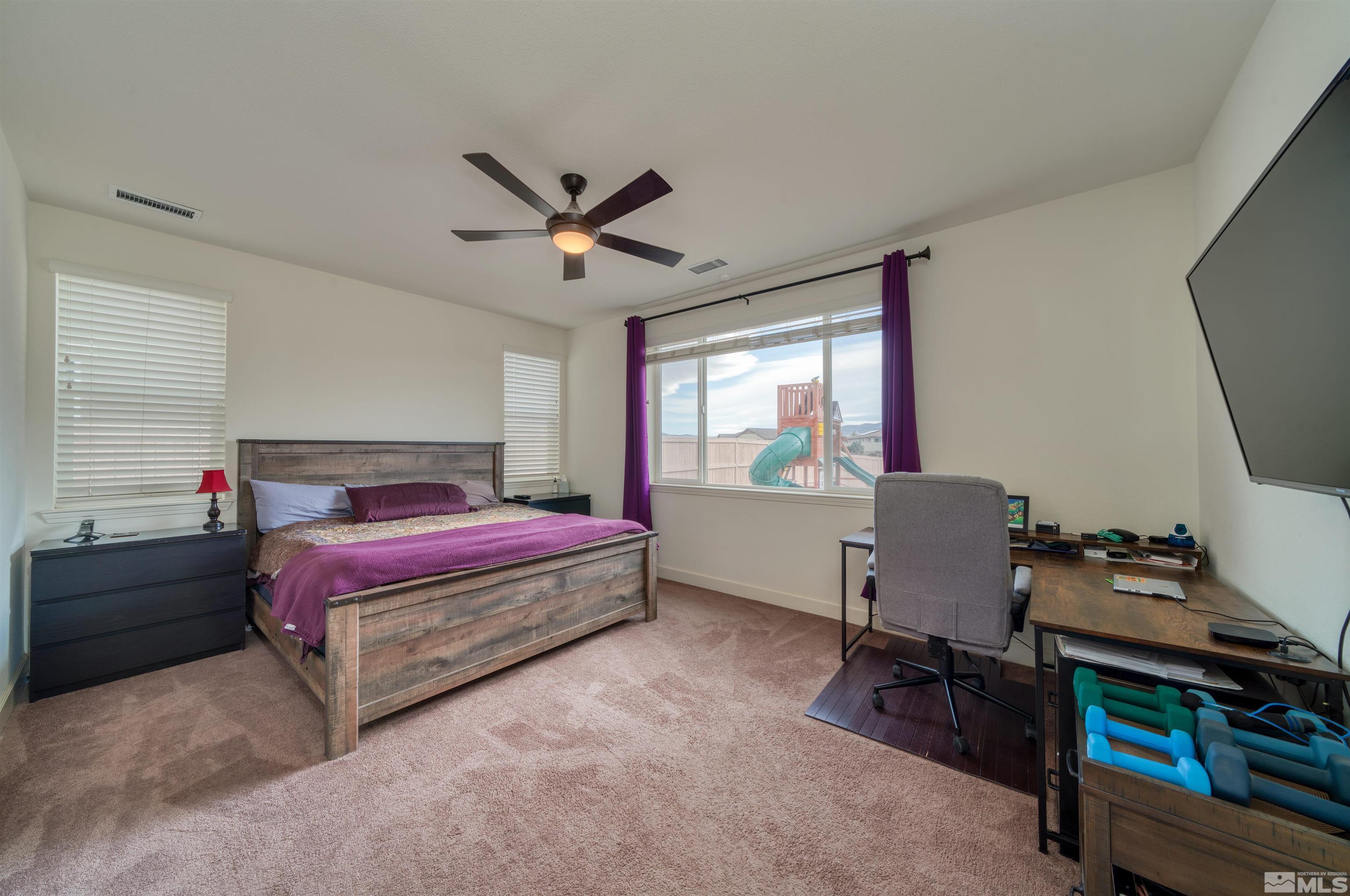 9784 Quartette Drive Reno, NV 89521 - Photo 10 of 18 a bedroom with a bed and a window