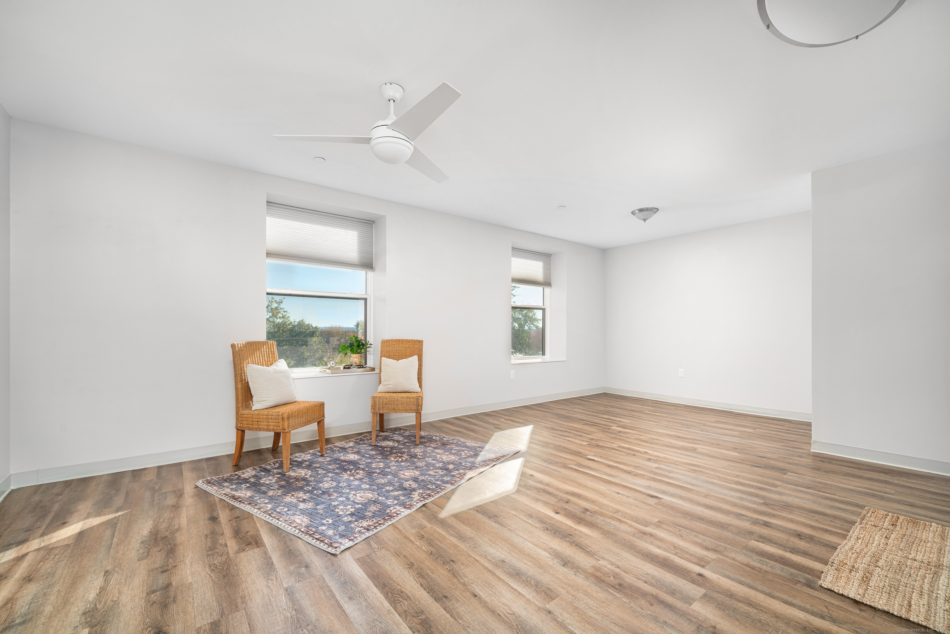 170 Ridge Road, Unit 304 Wethersfield, CT 06109 - Photo 4 of 25 a view of a livingroom with wooden floor and a window