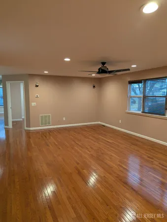 a view of a livingroom with wooden floor