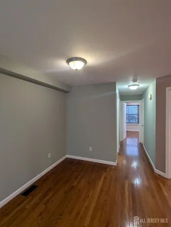 a view of gallery with wooden floor
