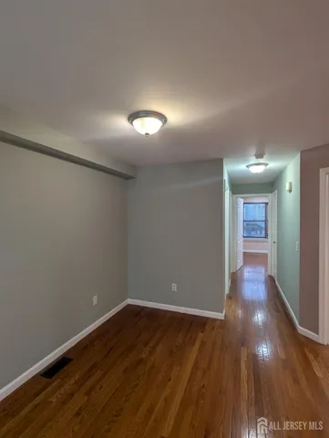 a view of gallery with wooden floor