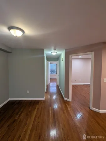 a view of gallery with wooden floor