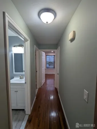 a white toilet sitting next to a shower