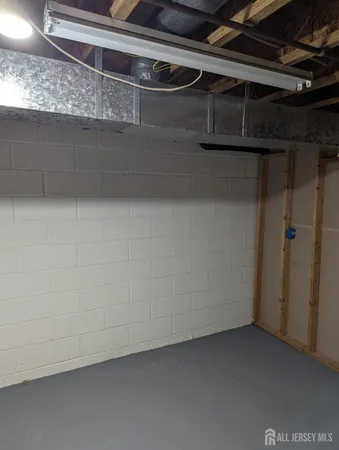 an empty room with closet and wooden door