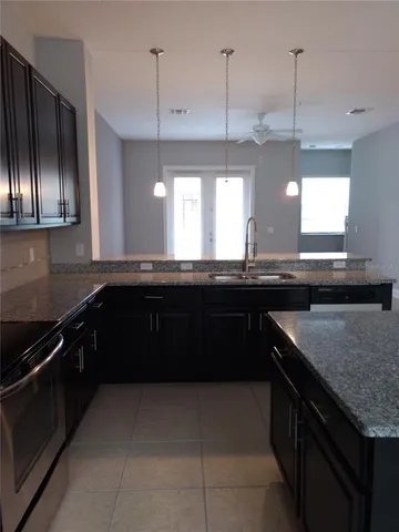 a kitchen with a sink and a stove