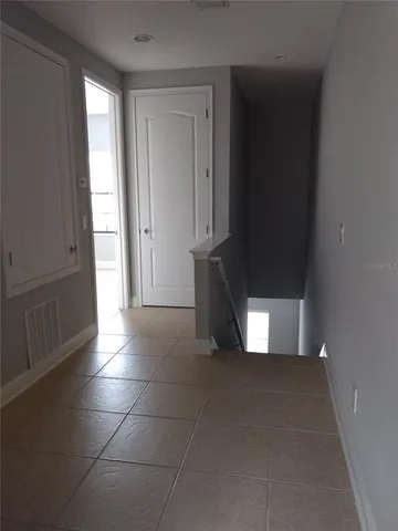 a view of empty room with windows