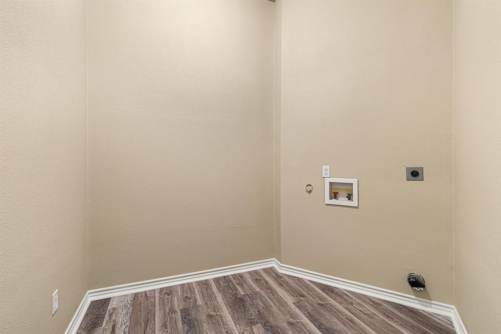 10160 Wallace Road Holland, TX 76534 - Photo 21 of 40 Washroom featuring wood finished floors, electric dryer hookup, hookup for a washing machine, hookup for a gas dryer, and a textured wall