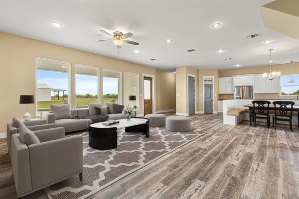 a living room with furniture and a large window