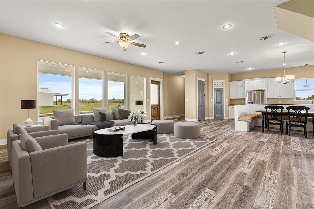 10160 Wallace Road Holland, TX 76534 - Photo 23 of 40 Living area with recessed lighting, light wood finished floors, a chandelier, and ceiling fan