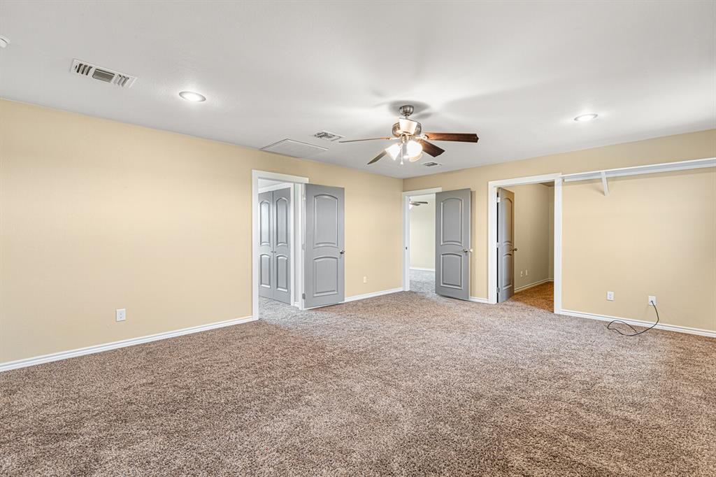 10160 Wallace Road Holland, TX 76534 - Photo 5 of 40 Unfurnished bedroom featuring carpet, ceiling fan, and recessed lighting