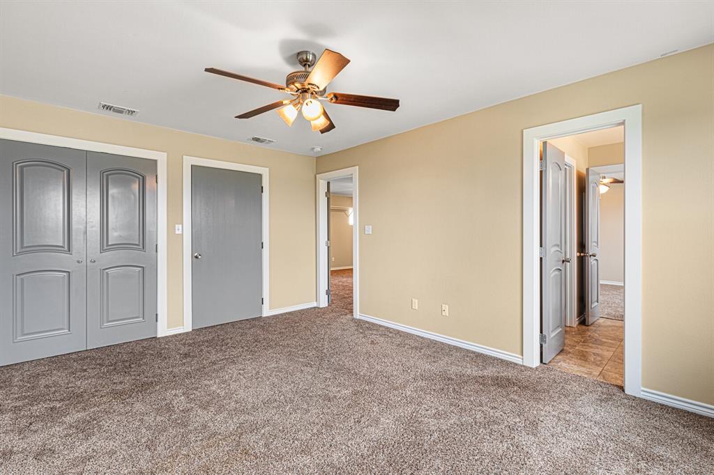 10160 Wallace Road Holland, TX 76534 - Photo 6 of 40 Unfurnished bedroom with carpet, ceiling fan, and a closet