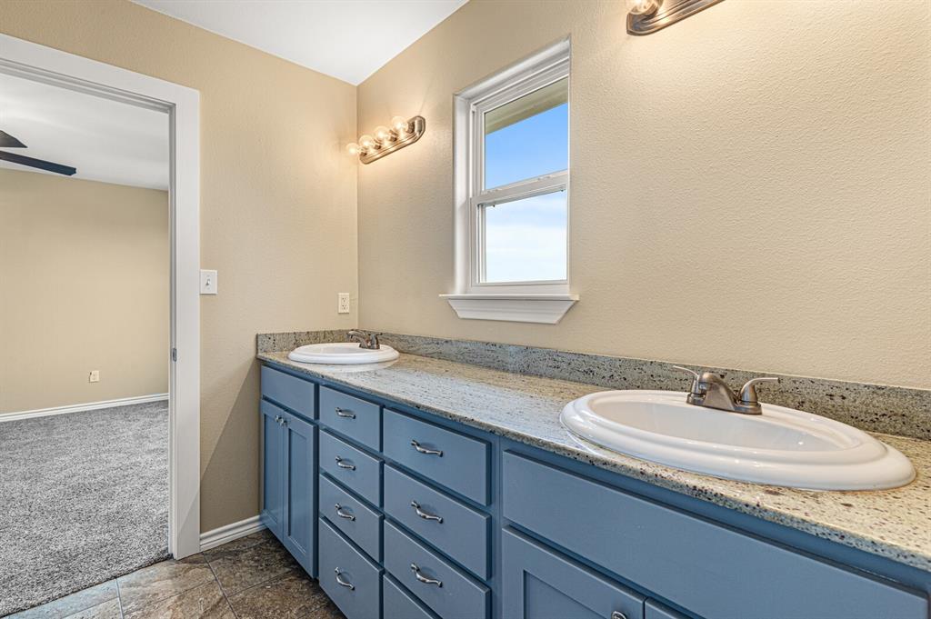 10160 Wallace Road Holland, TX 76534 - Photo 7 of 40 Full bath featuring double vanity and baseboards