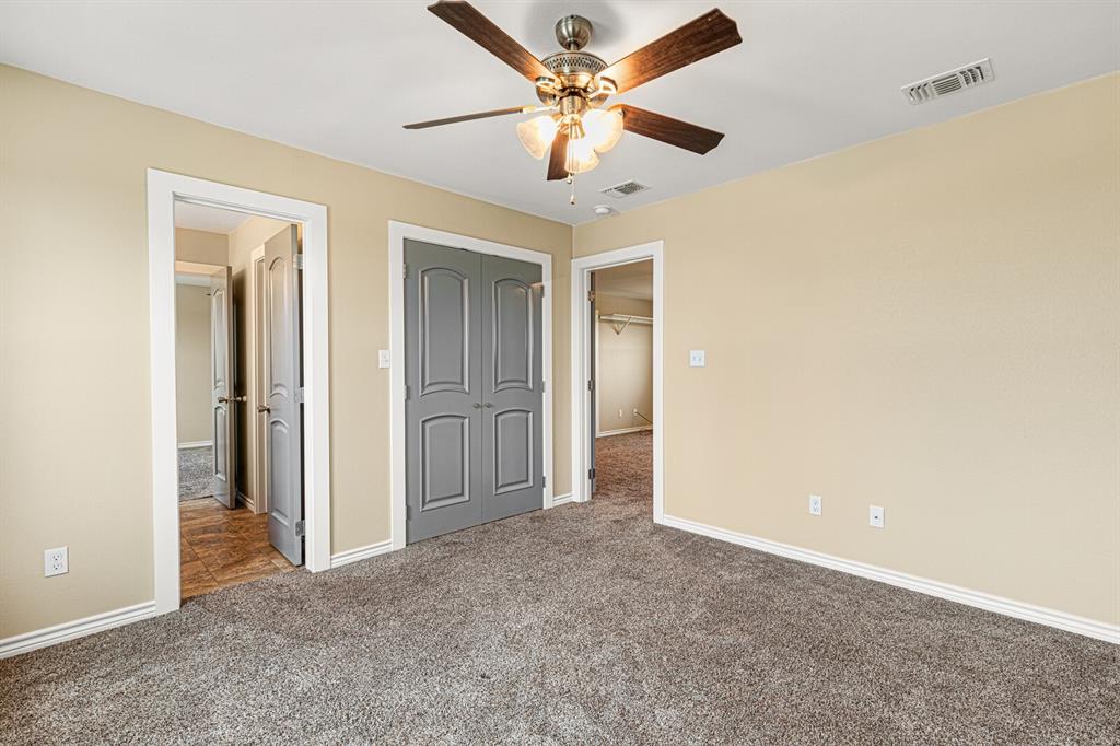 10160 Wallace Road Holland, TX 76534 - Photo 10 of 40 Unfurnished bedroom with a closet, carpet, and ceiling fan