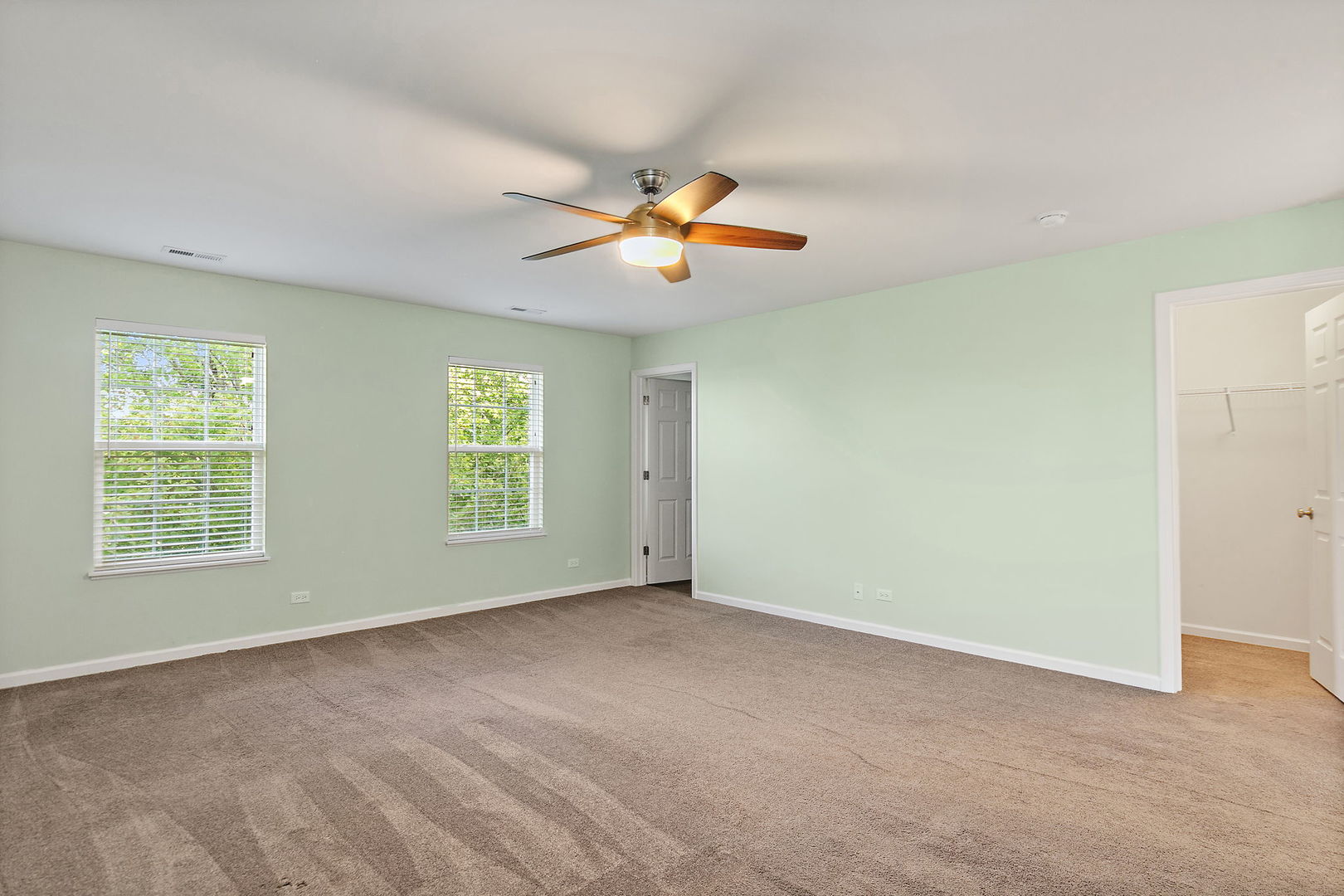 413 Town Center Boulevard Gilberts, IL 60136 - Photo 20 of 34 a view of a room with a window and a ceiling fan