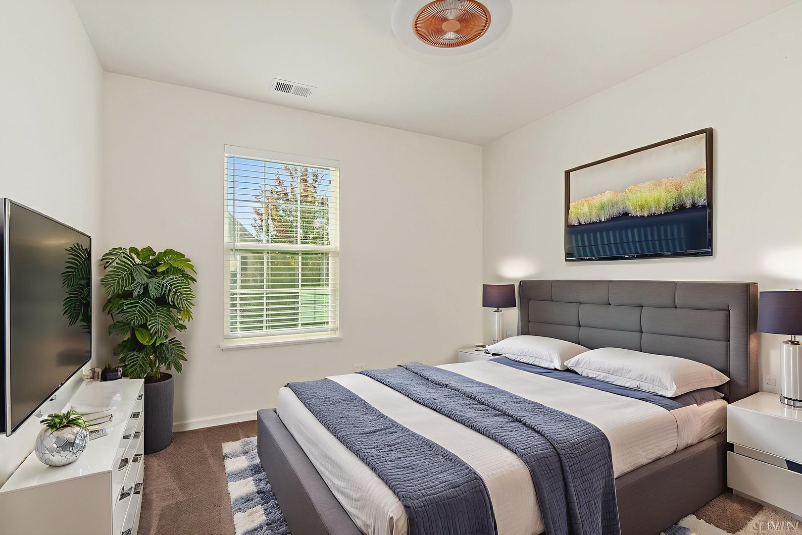413 Town Center Boulevard Gilberts, IL 60136 - Photo 25 of 34 a bedroom with a bed and a potted plant