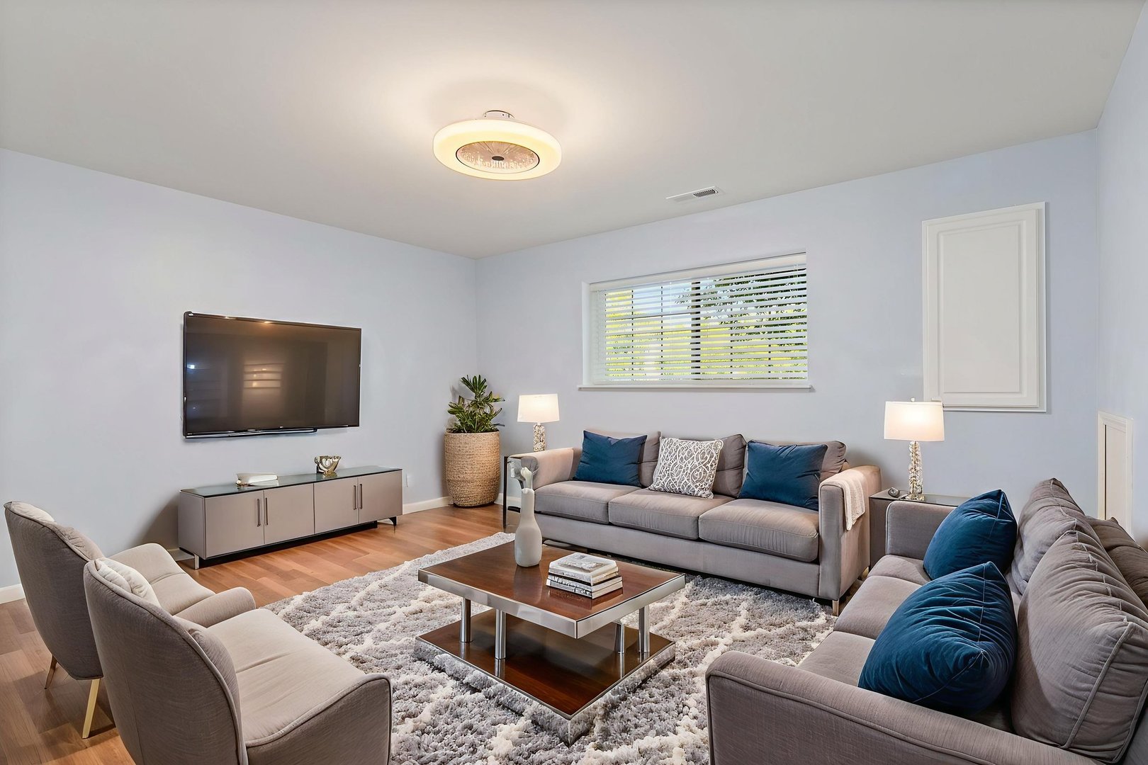 413 Town Center Boulevard Gilberts, IL 60136 - Photo 29 of 34 a living room with furniture and a flat screen tv