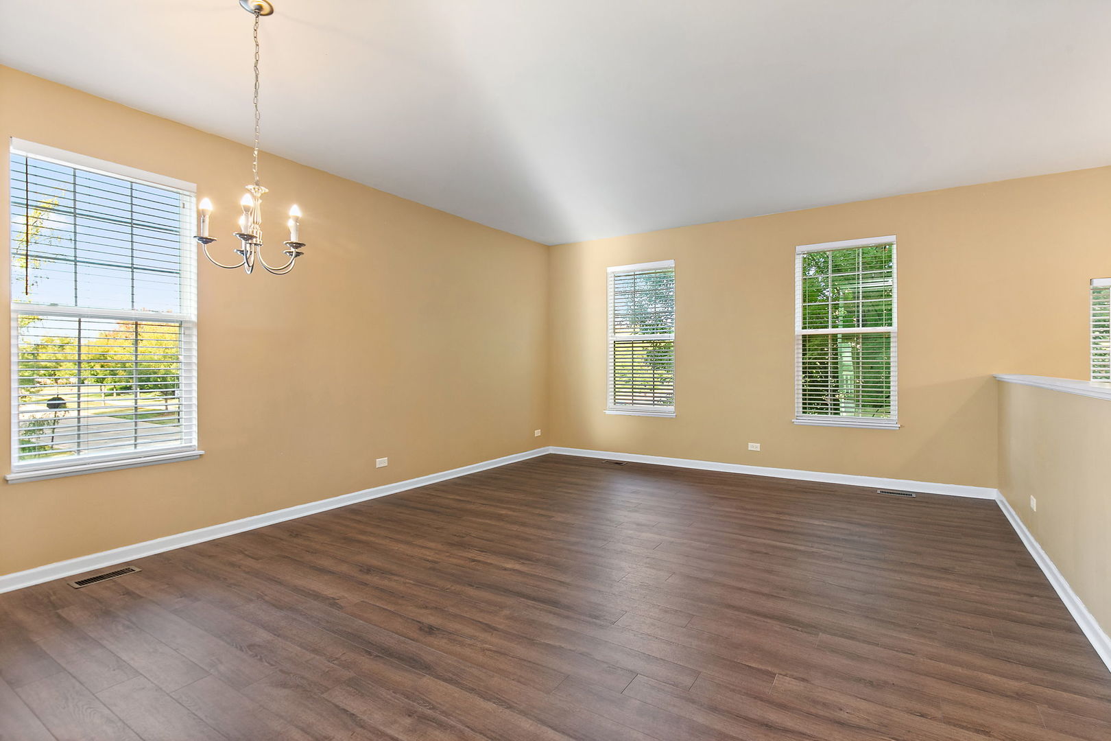 413 Town Center Boulevard Gilberts, IL 60136 - Photo 4 of 34 a view of an empty room with wooden floor and a window