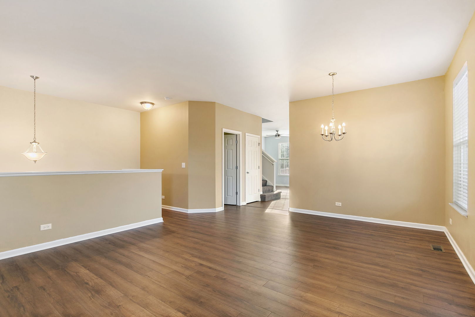 413 Town Center Boulevard Gilberts, IL 60136 - Photo 6 of 34 a view of an empty room with wooden floor