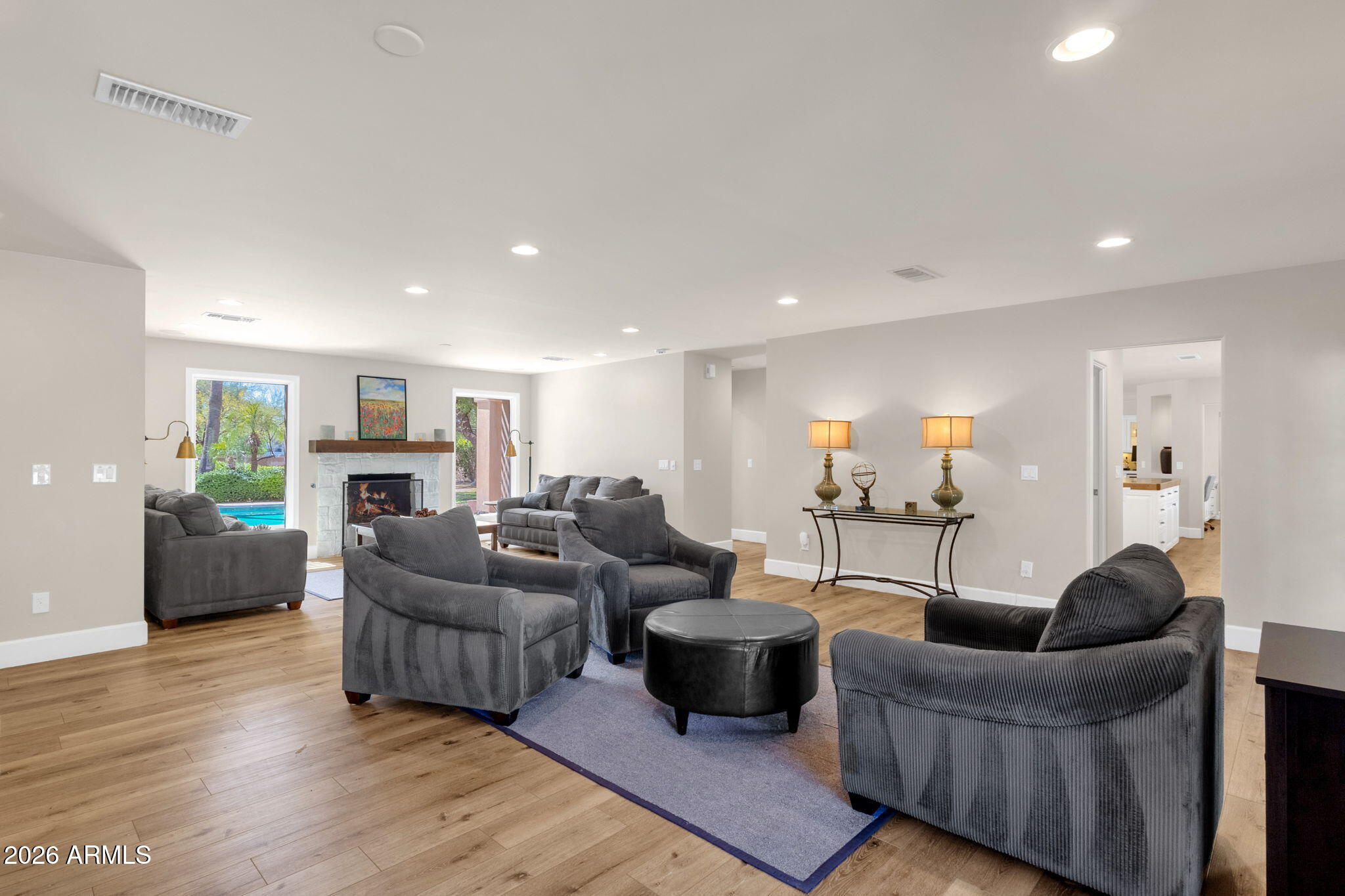 4139 East Colter Street Phoenix, AZ 85018 - Photo 16 of 58 a living room with furniture and a wooden floor