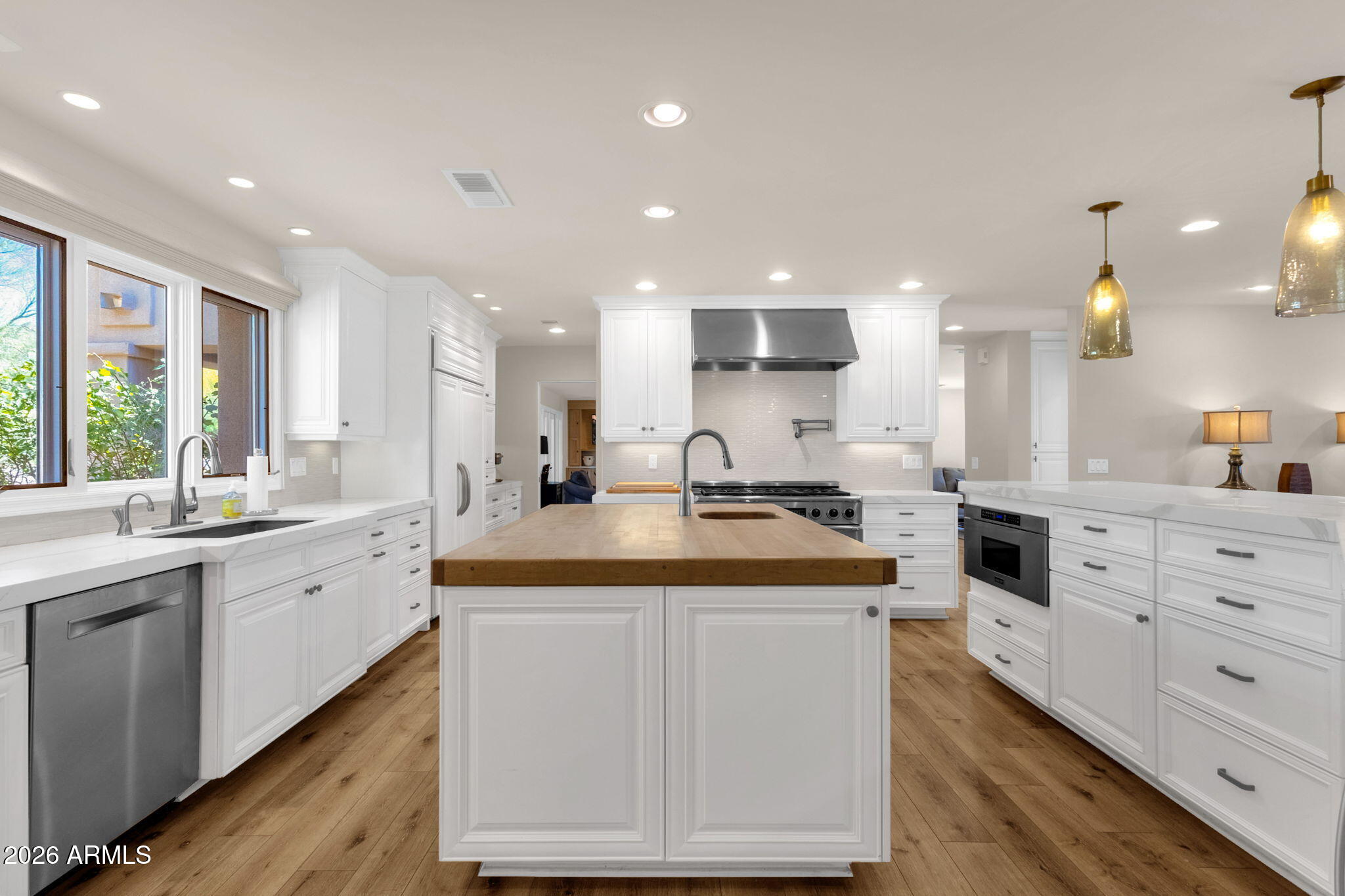 4139 East Colter Street Phoenix, AZ 85018 - Photo 20 of 58 a kitchen with sink stove and cabinets