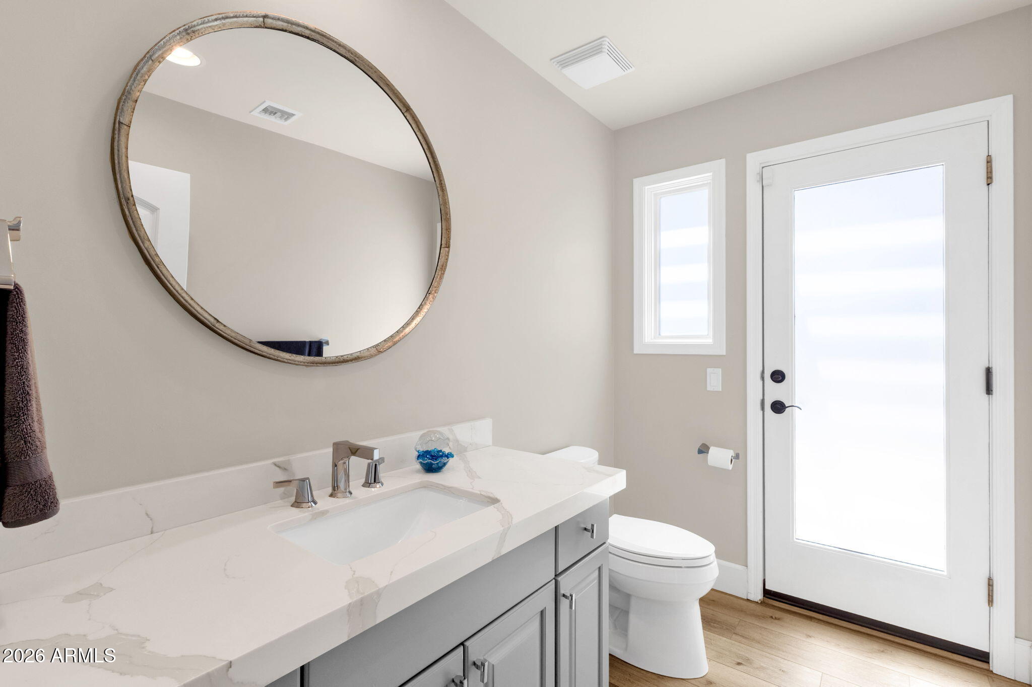4139 East Colter Street Phoenix, AZ 85018 - Photo 38 of 58 a bathroom with a sink a toilet and a mirror