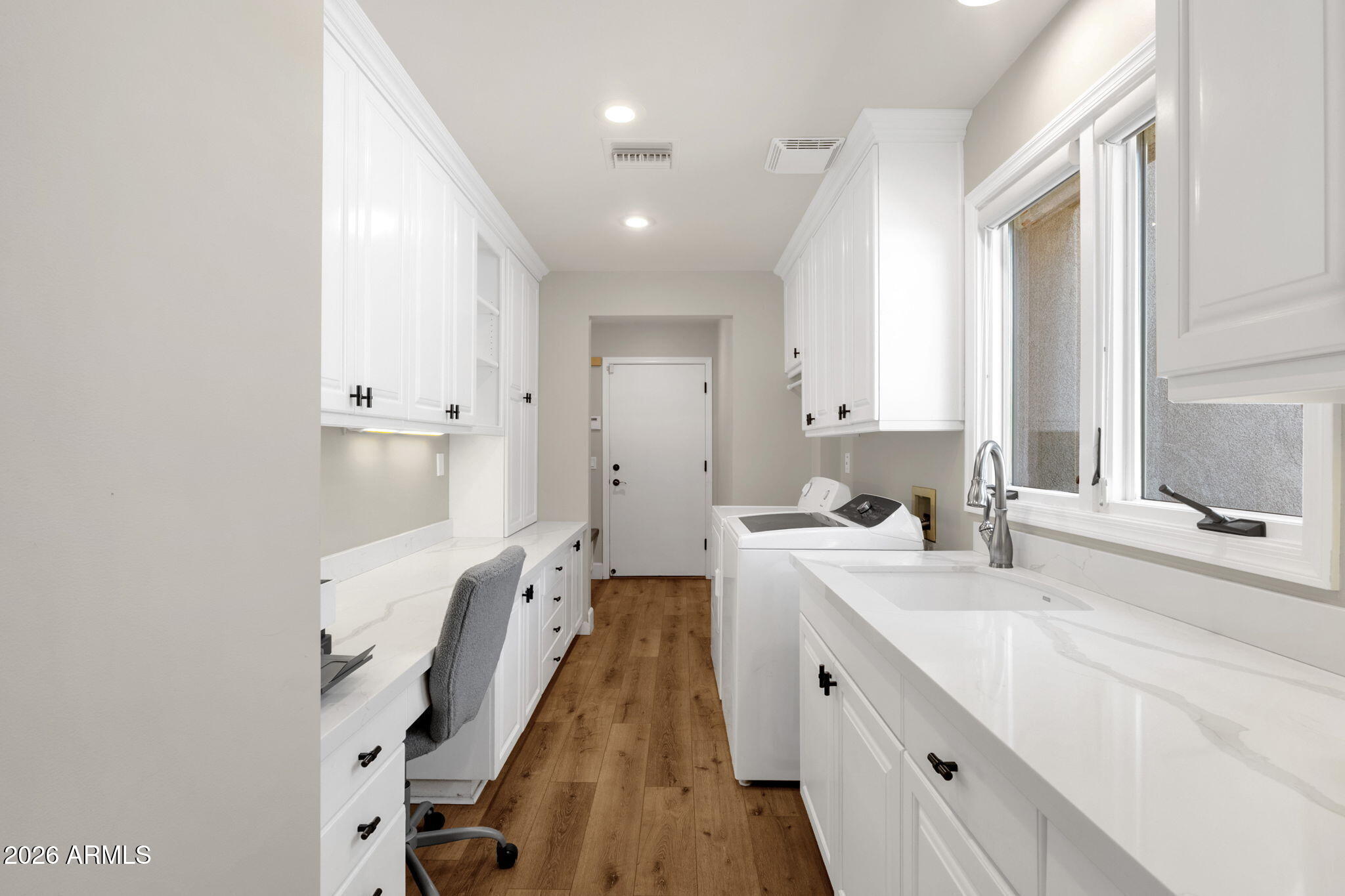 4139 East Colter Street Phoenix, AZ 85018 - Photo 42 of 58 a spacious bathroom with a double vanity sink and mirror