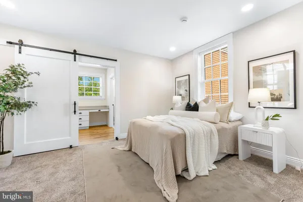 a bedroom with bed and window