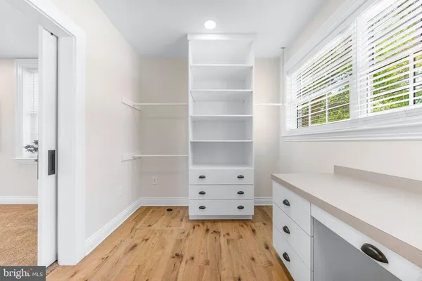 a room with walk in closet and window