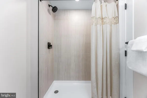 a bathroom with a tub and shower