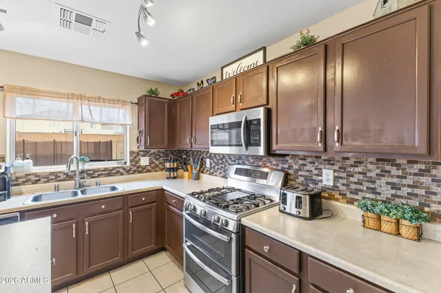 a bathroom with a sink a mirror and a toilet