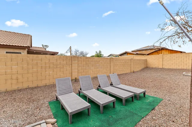 an aerial view of a house with a swimming pool