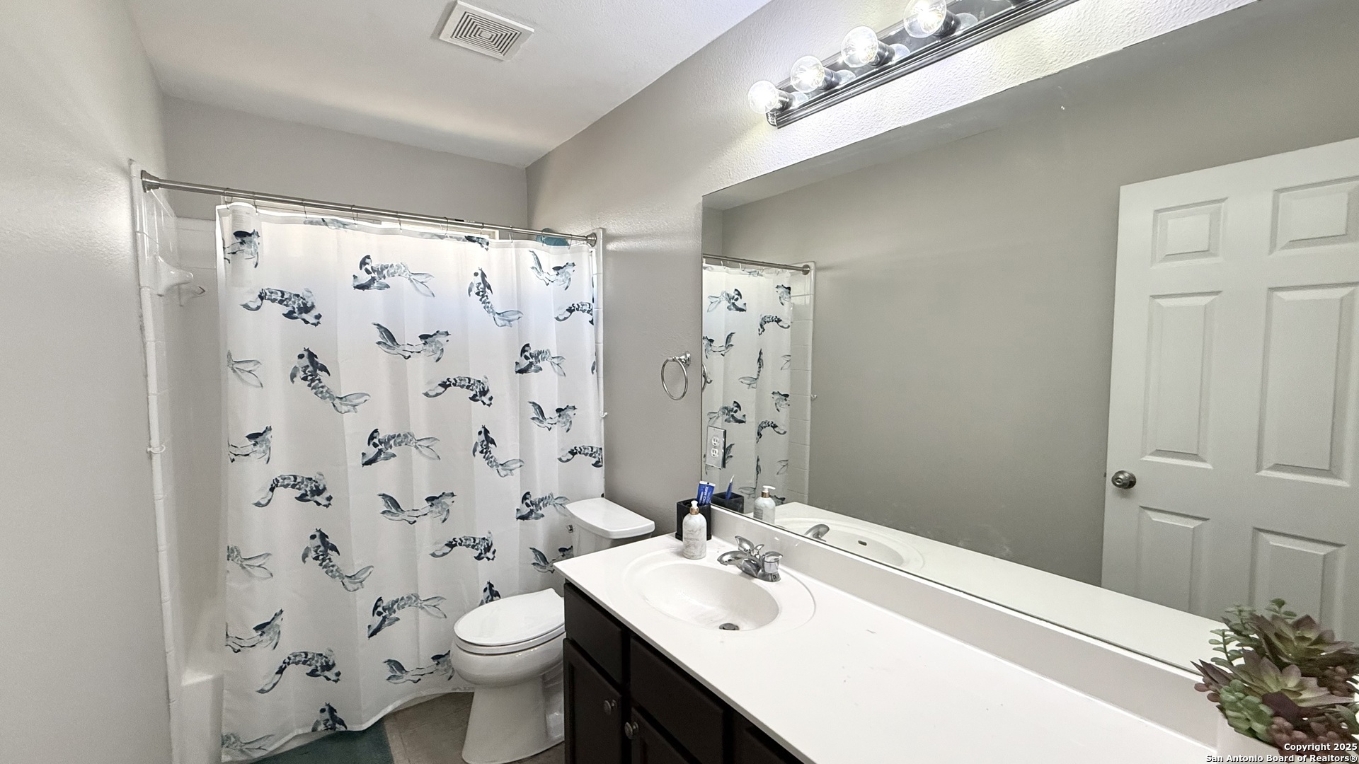 9402 Anderson Way Converse, TX 78109 - Photo 17 of 37 a bathroom with a sink vanity mirror and toilet