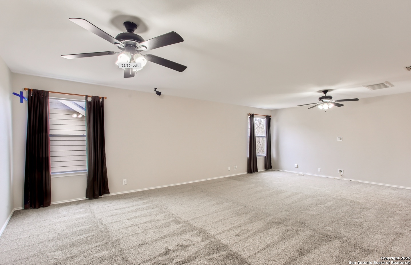9402 Anderson Way Converse, TX 78109 - Photo 26 of 37 a view of a big room with a ceiling fan and a chandelier fan