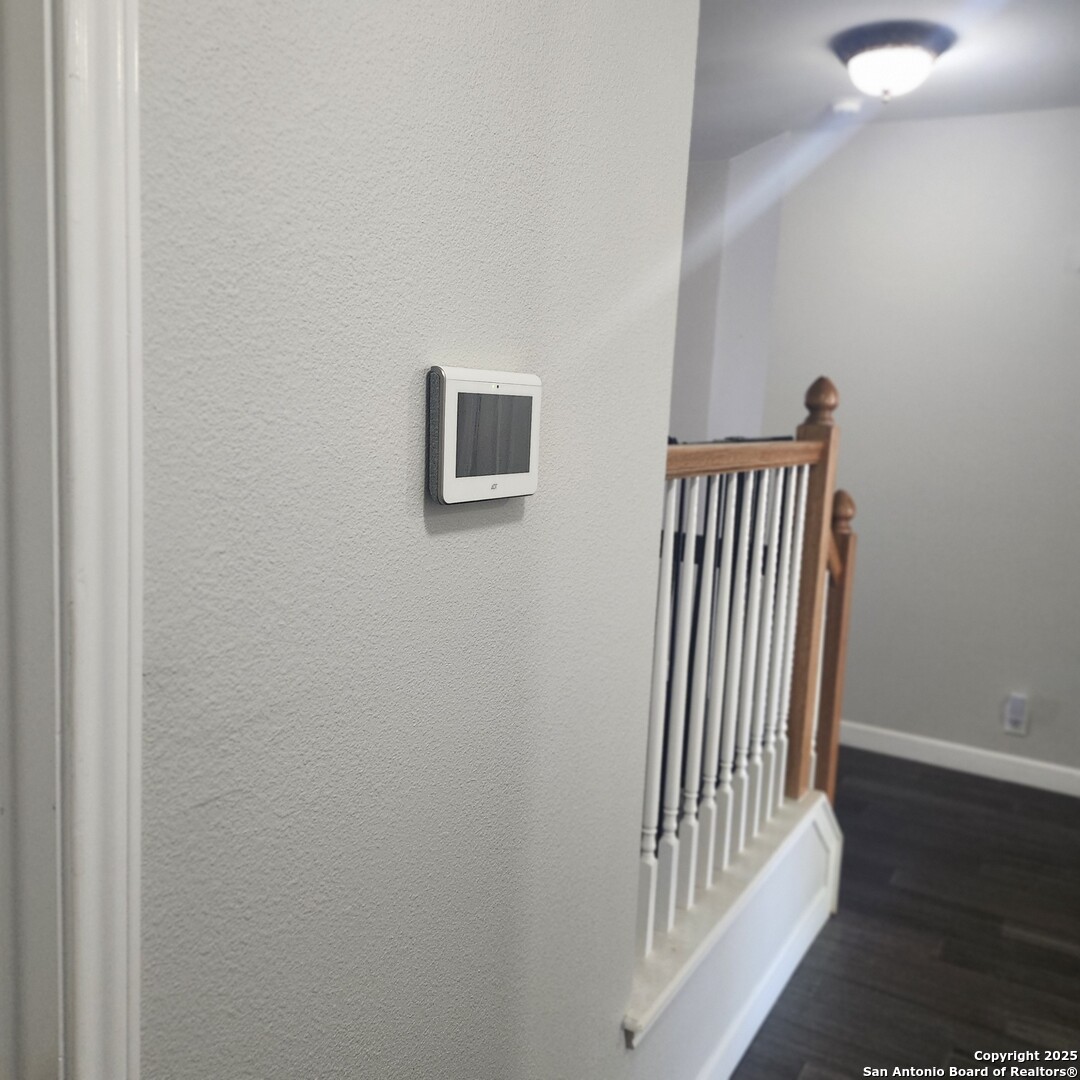 9402 Anderson Way Converse, TX 78109 - Photo 27 of 37 a view of a hallway with wooden floor and a bathroom