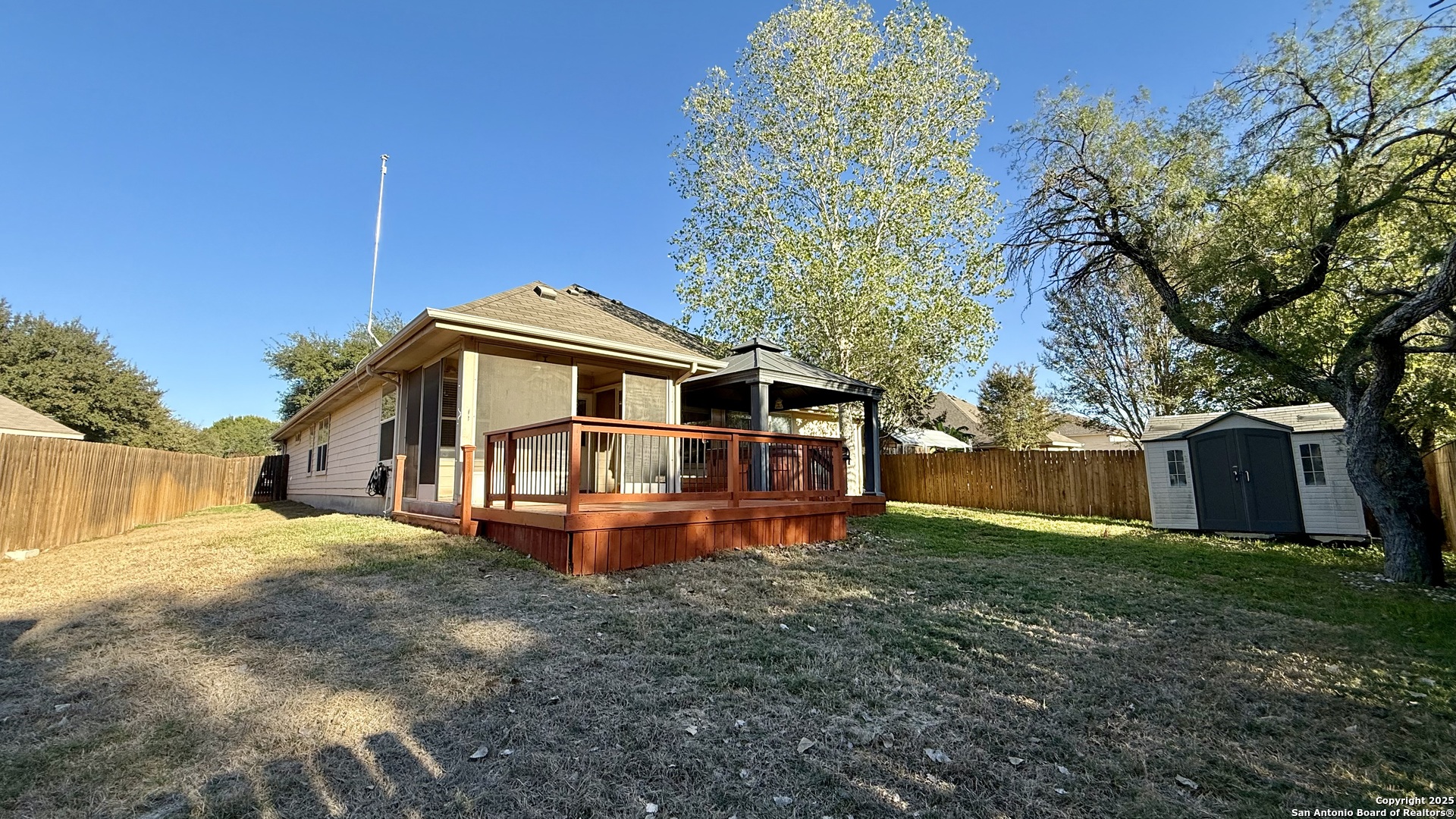 9402 Anderson Way Converse, TX 78109 - Photo 31 of 37 a front view of a house with a yard table and chairs