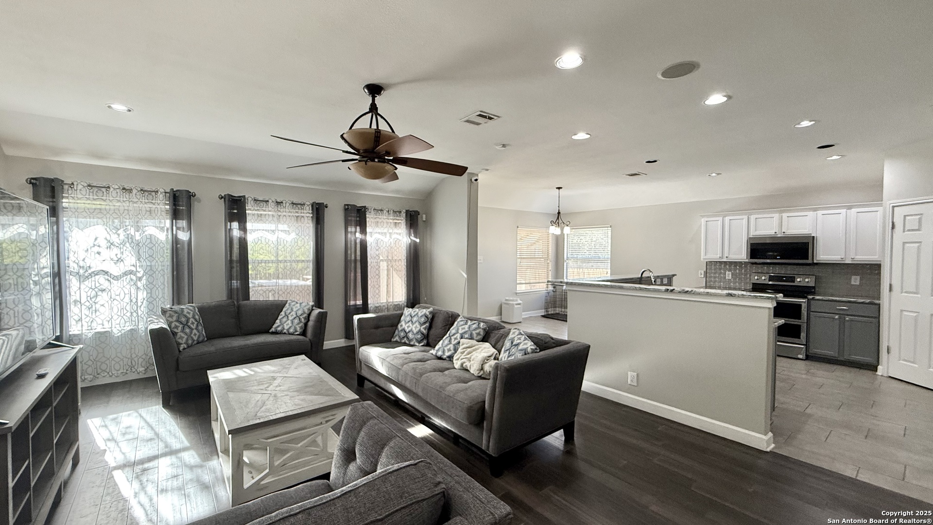 9402 Anderson Way Converse, TX 78109 - Photo 4 of 37 a living room with stainless steel appliances furniture and a kitchen view