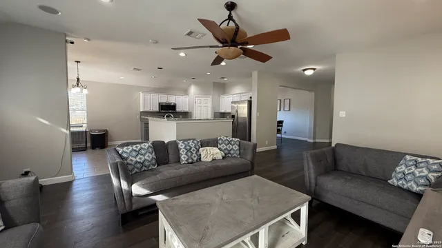 a room with hard wood floor and window