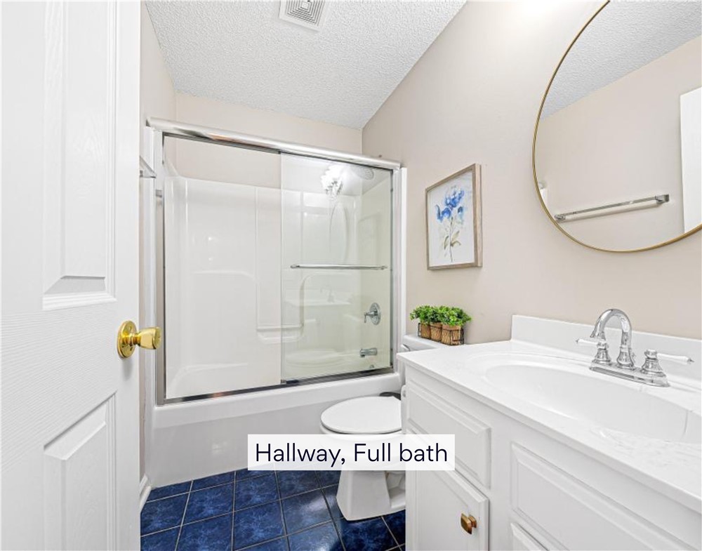 848 Perkins Creek Road Seneca, SC 29678 - Photo 20 of 26 A compact bath features a tiled shower-tub combo and single vanity, providing essential amenities.