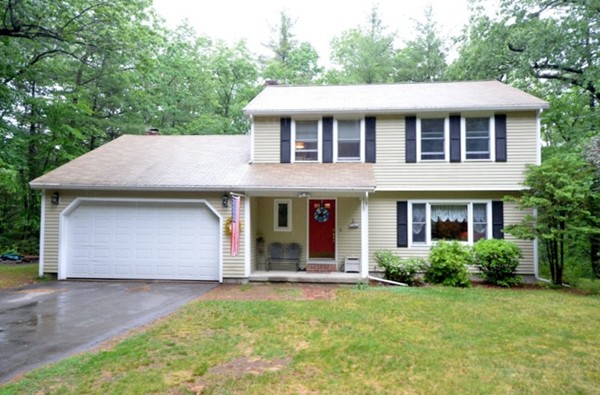 115 Lawton Road Shirley, MA 01464 - Photo 1 of 13 a front view of a house with a yard and garage