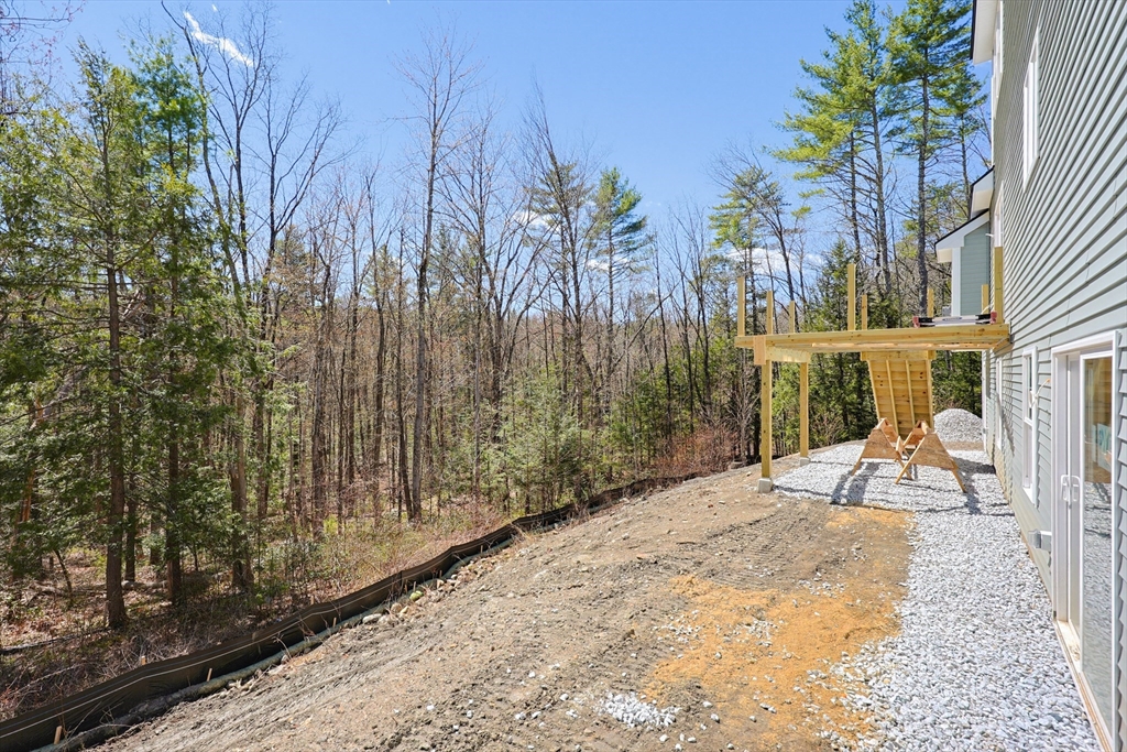 112 West Meadow Road Townsend, MA 01474 - Photo 34 of 38 a view of a backyard with potted plants and large trees