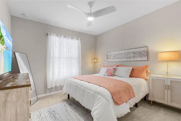 a bedroom with a bed and a couch