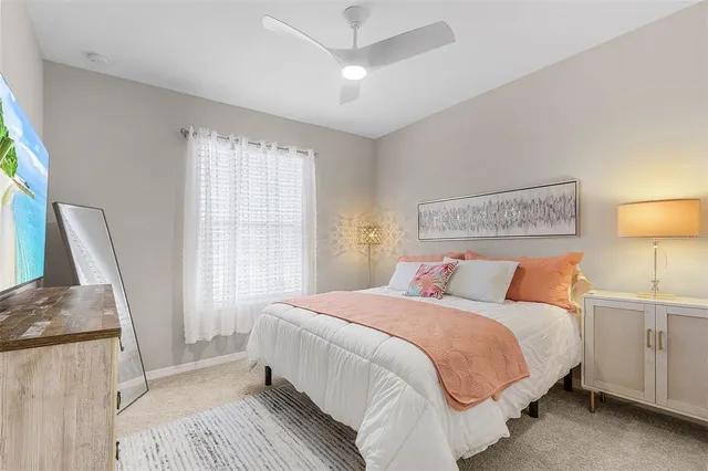 a bedroom with a bed and a couch