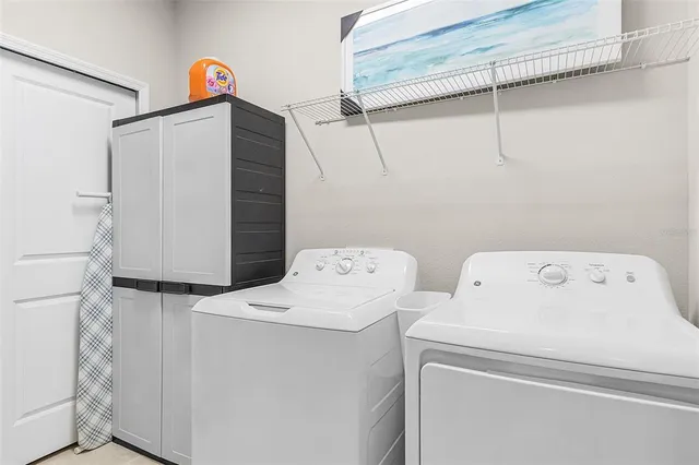 a utility room with dryer and washer