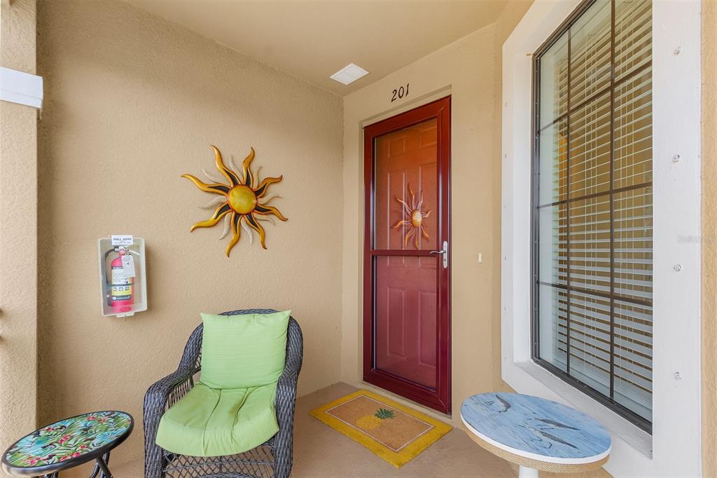 13725 Messina Loop, Unit 201 Bradenton, FL 34211 - Photo 3 of 39 a living room with furniture and a potted plant