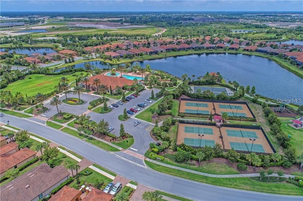 13725 Messina Loop, Unit 201 Bradenton, FL 34211 - Photo 32 of 39 an aerial view of residential houses with outdoor space and street view